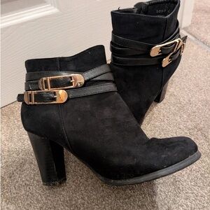 Elegant Black Heeled Boots with Gold Accents